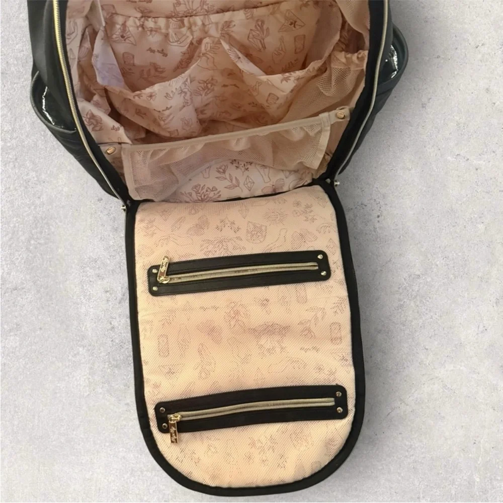 Itzy Ritzy Boss Plus black diaper bag backpack with gold hardware.